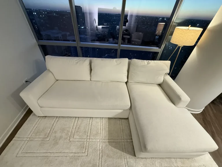 White sectional in a high-rise living room