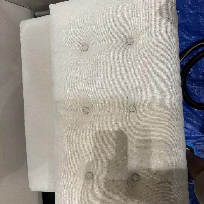 Tufted cushion half cleaned