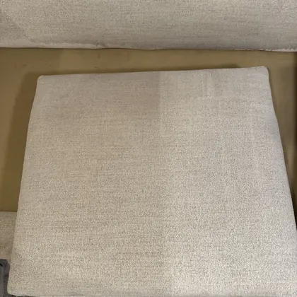 Cushion mid-clean showing the cleaned and uncleaned halves